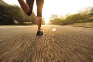 healthy lifestyle fitness sports woman running on road