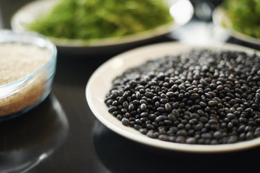 A close up of a plate of black beans as part of a low-carb diet.
