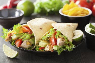 mexican tortilla wrap with chicken breast and vegetables