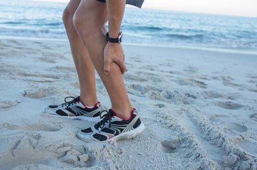 Fit man having muscle pain