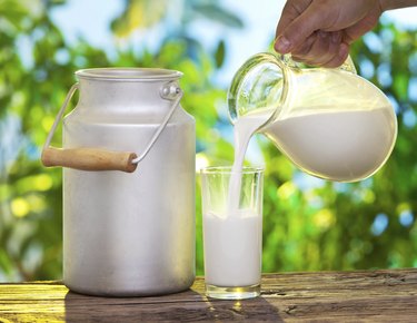 Pouring milk in the glass.