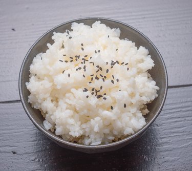 cooked rice with black sesame on bowl