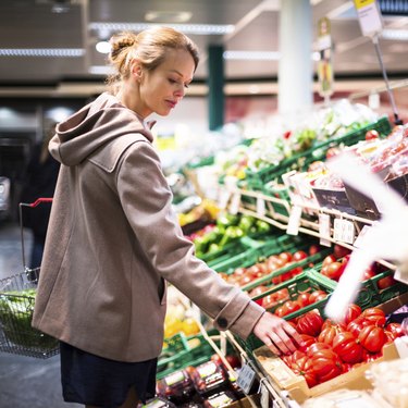 Pretty, young woman shopping for fruits and vegetables