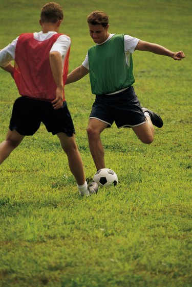 Teenage boys playing soccer