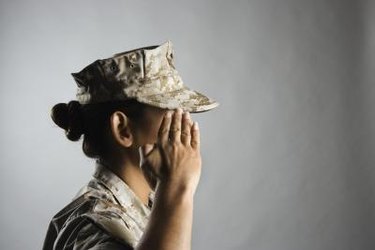 Profile of United States Marine saluting