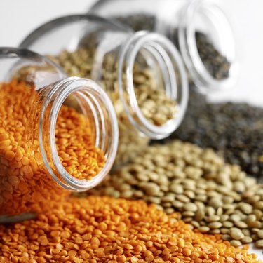Colorful lentils with glass jars