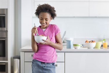 Girl Eating Cereal for Breakfast