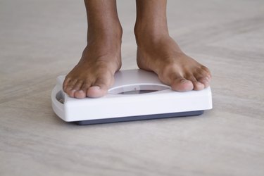 Person standing on a weighing scale