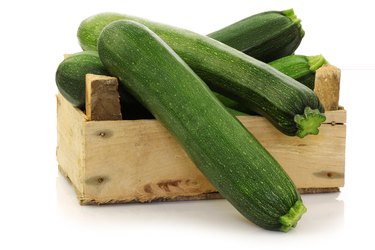 fresh zucchini's in a wooden box