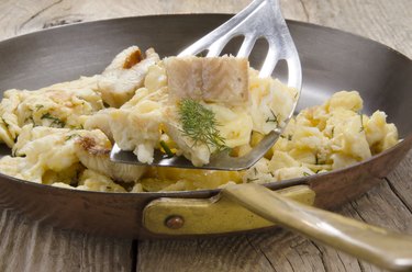 smoked eel and scrambled eggs in a pan