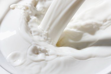 Milk pouring into a bowl