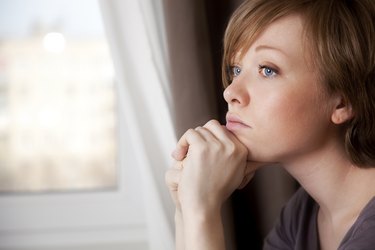 beautiful young woman near the window