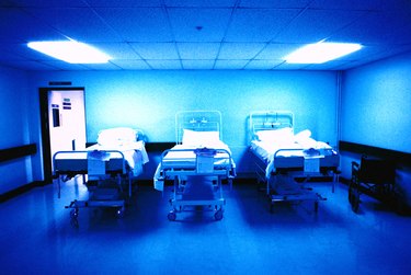 interior of a hospital recovery room with three beds