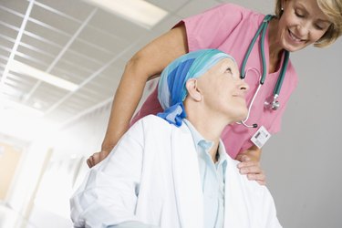 Medical Staff Pushing Patient in Wheelchair