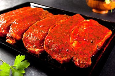fillets marinated pork loin ready to cook.