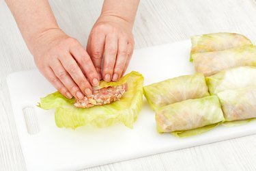 chef prepares stuffed cabbage rolls