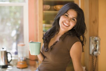 Woman holding a cup of coffee