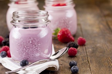 Small jars with homemade fruit yogurt