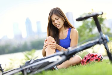 Knee pain bike injury woman