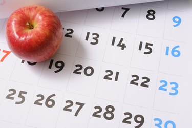 Red apple on calendar