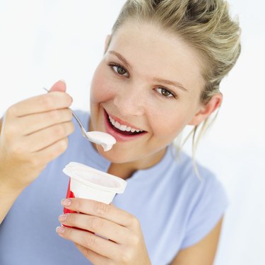 woman eating a yoghurt