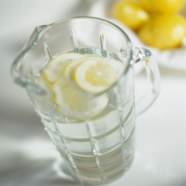 Pitcher of Water Garnished with Lemon Slices