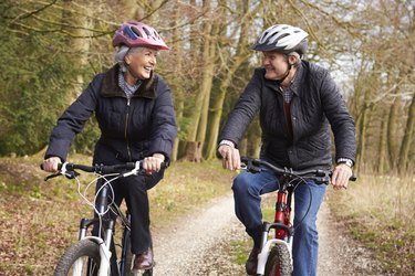 Senior couple with knee arthritis riding bikes