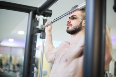 Bodybuilder Doing Pull Ups Best Back Exercises