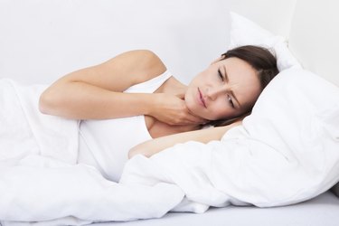 Sick Woman Lying In Bed