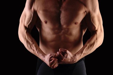 Professionals Share Expert Tips For Packing On Chest Mass