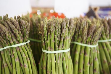 Raw fresh asparagus at the outdoor market