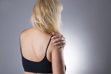 Woman with pain in shoulder. Pain in the human body