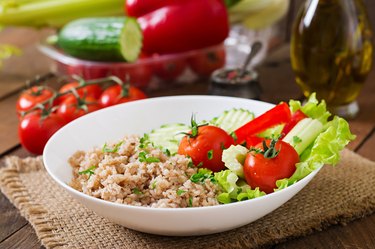 Porridge with fresh vegetables and lettuce. Healthy breakfast