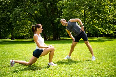 Warm up - couple exercising before jogging