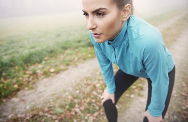 tired runner leaning over