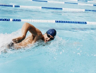 Young Man Swimming in a Swimming Pool