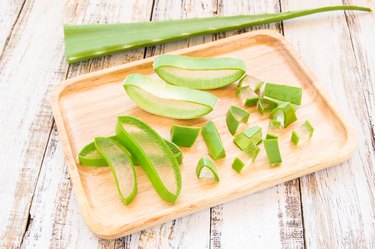 Close up Aloe Vera leaves in wooden palte