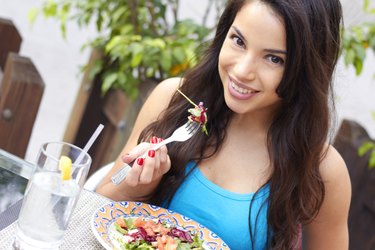 Young Beautiful Hispanic Woman Having Fresh Salad