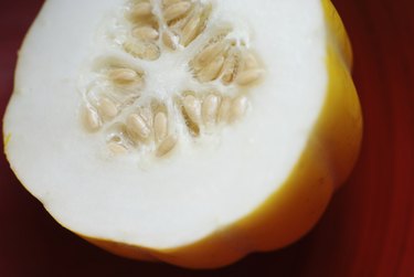 Close-up of a yellow Thai squash cut in half.