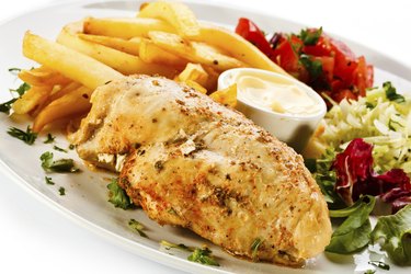 "Grilled meat, French fries and vegetables"