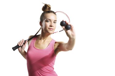 athletic woman with squash racket
