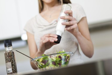 Woman preparing salad