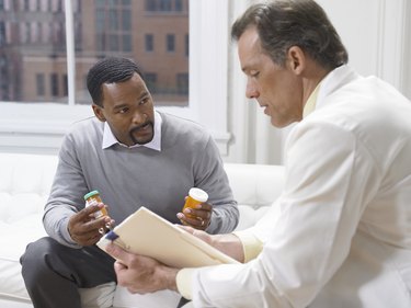 Doctor Giving an Explanation About the Medicine Given to a Male Patient