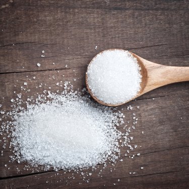 sugar in a wooden spoon