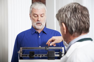 Doctor Weighing Patient