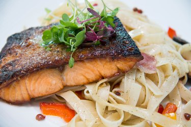 pasta with salmon on white  plate