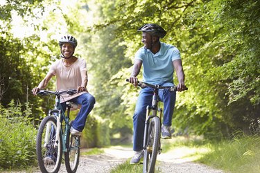Mature African American Couple On Cycle Ride In Countryside