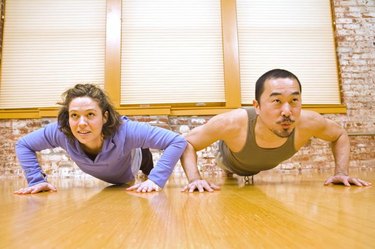 Man and Woman Doing Pushups