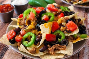 Plate of spicy fully loaded Mexican nachos