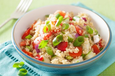 healthy quinoa salad with tomato cucumber onion chives